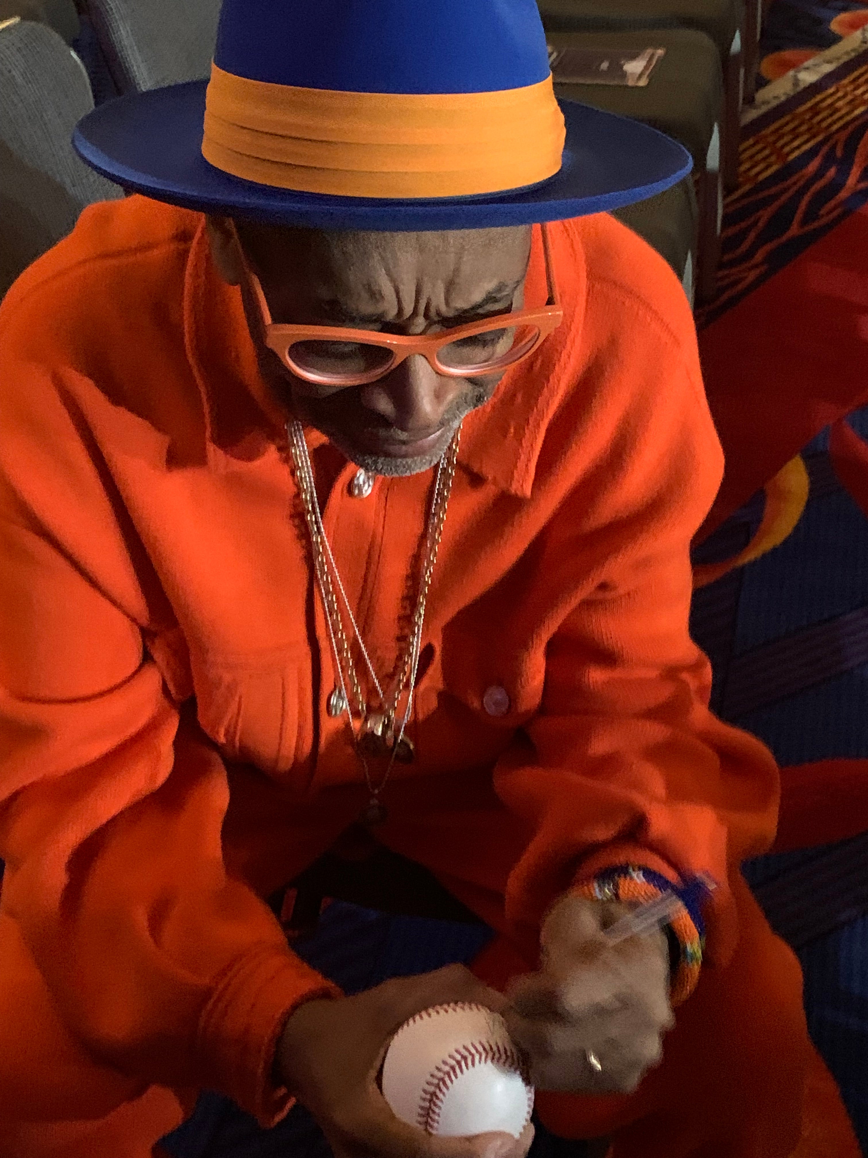 superfan-spike-lee-signs-a-baseball-for-a-fan-at-the-media-awards-night.jpg